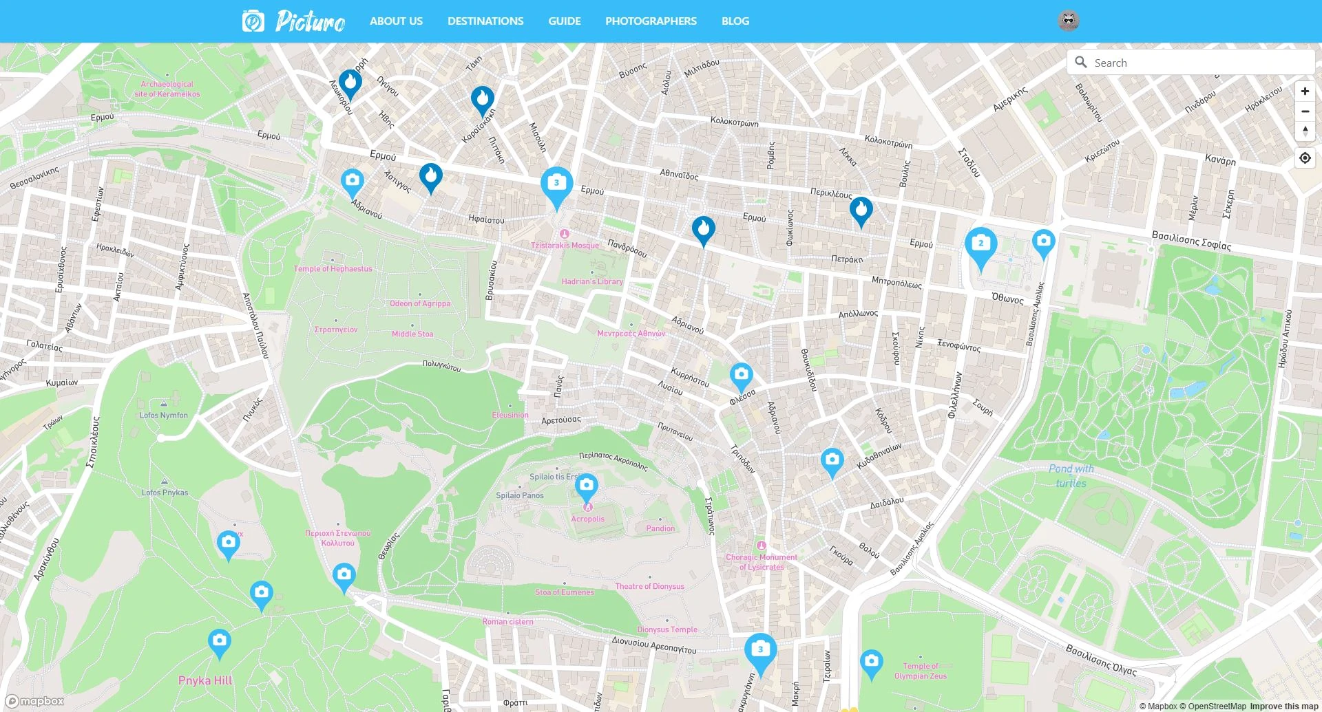 The Picturo map of Athens displayed on a screen, highlighting various hotspots around the city, such as iconic landmarks and popular locations. Markers are placed on the map to show the locations of photographers, with pins indicating their specific areas of operation, while vibrant streets and landmarks are clearly visible on the detailed map layout.